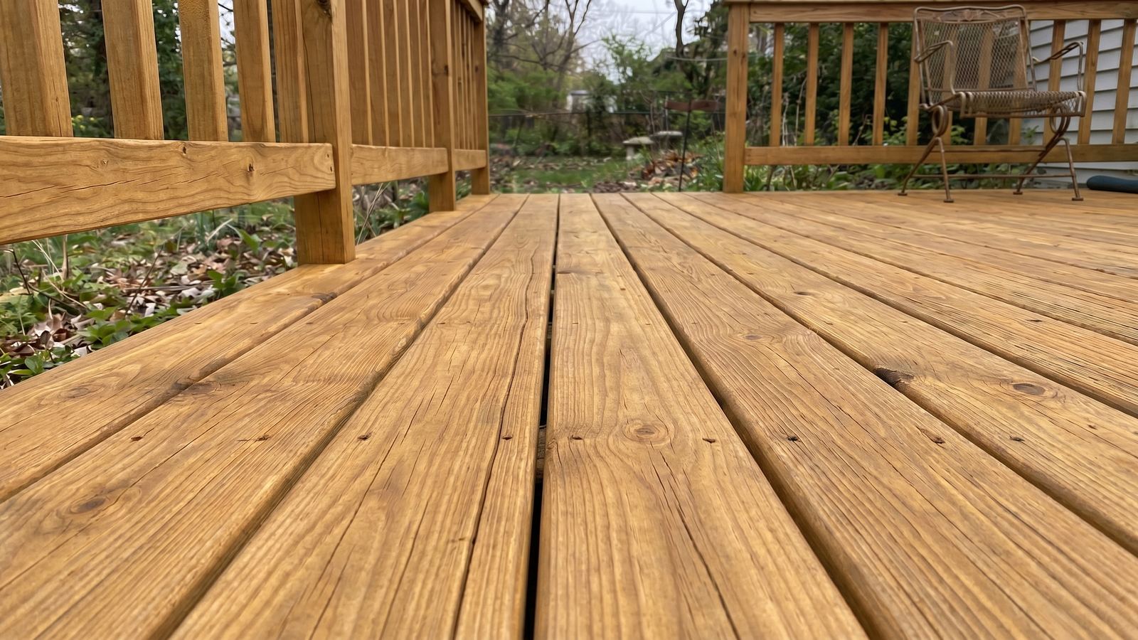 Wood deck cleaning — restored natural tone Houston